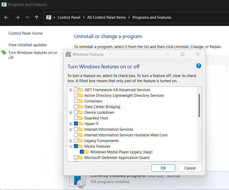 Windows Features dialog showing Windows Media Player Legacy enabled under Media Features